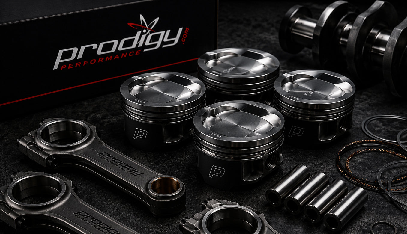 Automotive engine parts with Prodigy Performance branding on a dark background