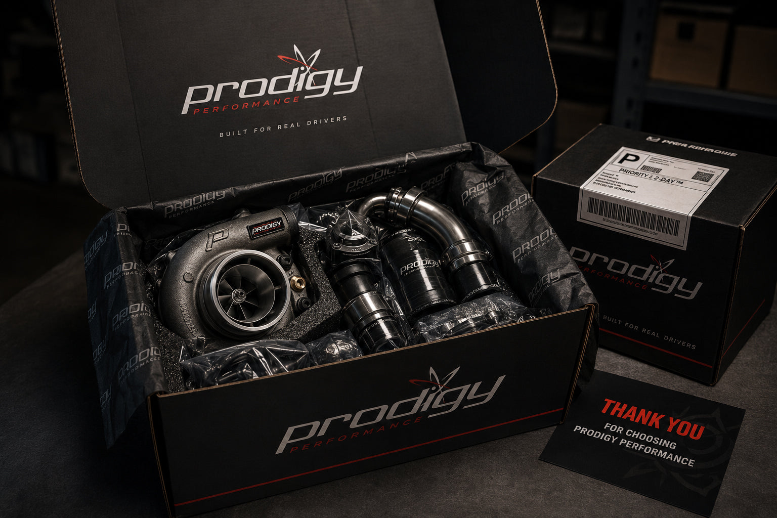 Turbocharger in a Prodigy Performance box with branded accessories.