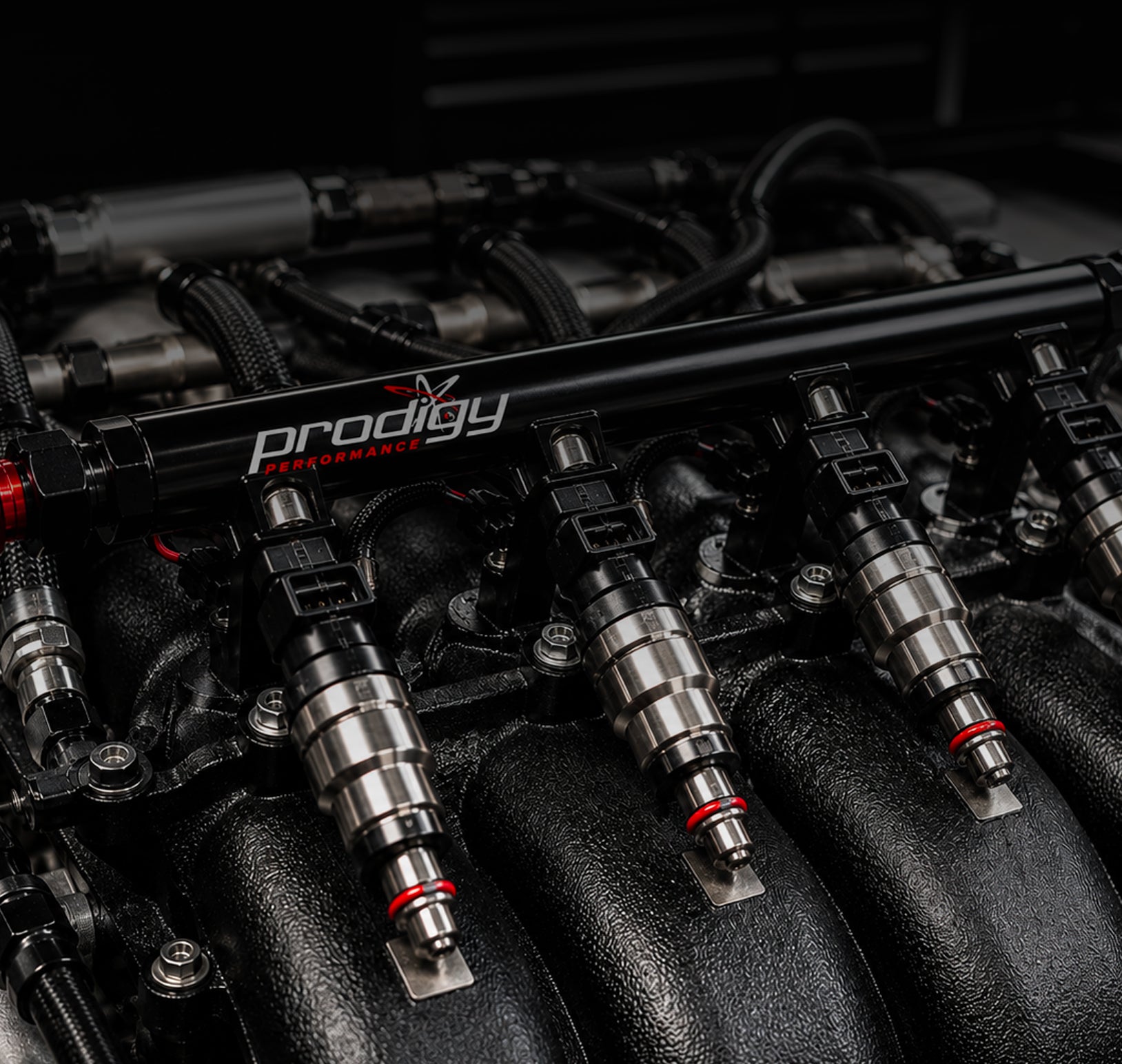 Fuel injectors with 'Prodigy' branding on a dark background