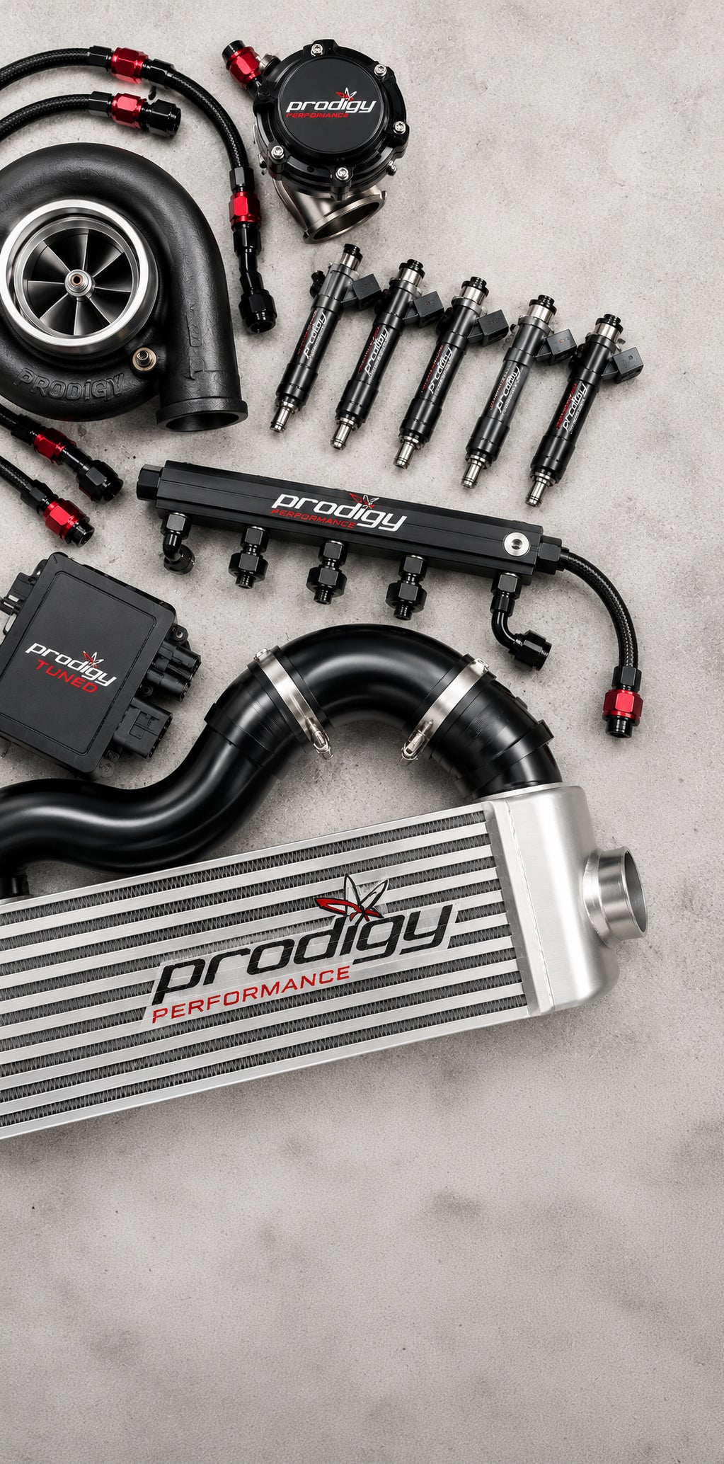 Automotive parts with 'Prodigy Performance' branding on a gray surface